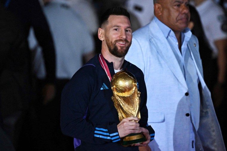 Messi and Argentina parade the World Cup trophy in Buenos Aires on Dec. 20, 2022. 