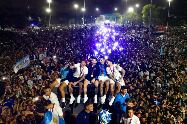 Argentina's captain and forward Lionel Messi on board a bus as he celebrates with teammates and supporters in Buenos Aires, Argentina on Dec. 20, 2022. 