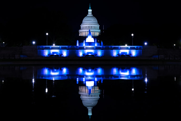 The U.S. Capitol dome reflects in the Lower Senate Park reflecting pool in Washington.