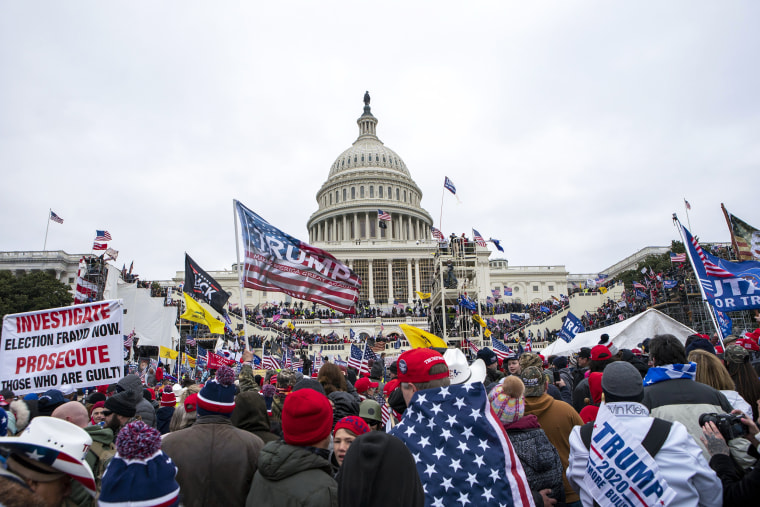 FILE - Rioters loyal to President Donald Trump rally at the U.S. Capitol in Washington on Jan. 6, 2021. Jean Lavin and her daughter Carla Krzywicki, both of Canterbury, Connecticut, pleaded guilty on Tuesday, Jan. 11, 2022, to parading, demonstrating or picketing, when they climbed a bicycle rack to get inside the Capitol building.