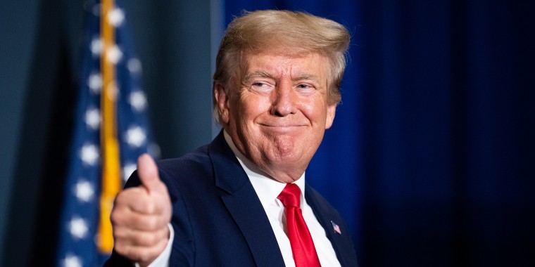 Image: Former President Donald Trump give a thumbs up.