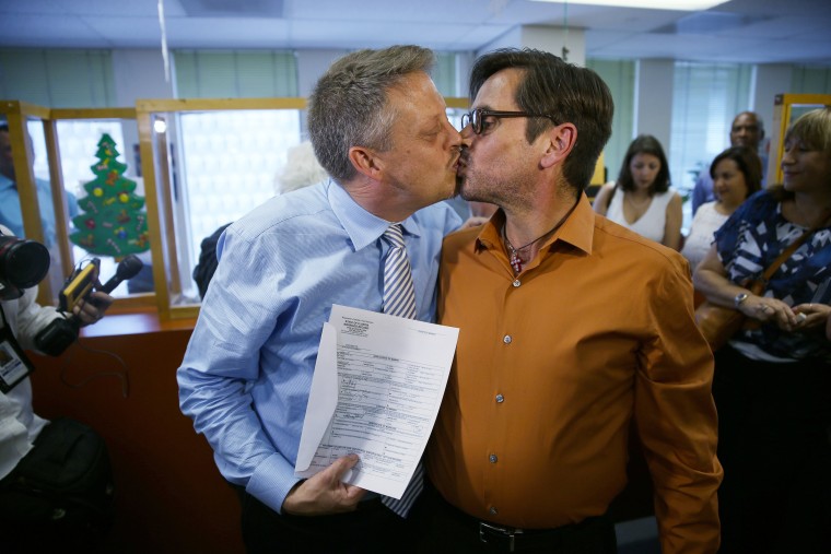 Don Johnston, left, and Jorge Diaz kiss after getting a marriage license in Miami on Jan. 5, 2015.