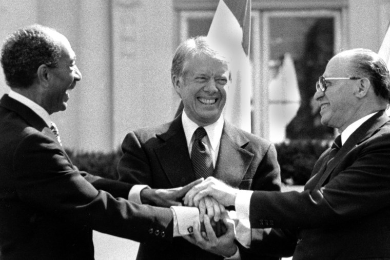 Egyptian President Anwar Sadat, President Jimmy Carter and Israeli Prime Minister Menachem Begin   after signing the peace treaty between Egypt and Israel at the White House on March 26, 1979.  