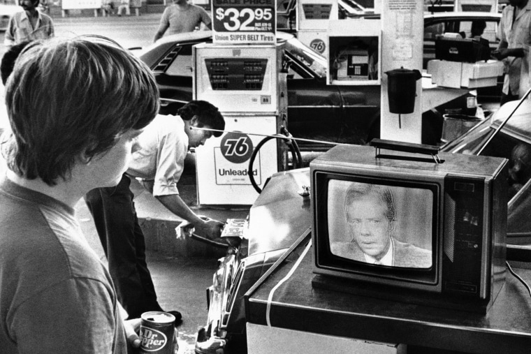 College student Chuck McManis watches President Jimmy Carter's nationally televised energy speech from a service station in Los Angeles on July 15, 1979.