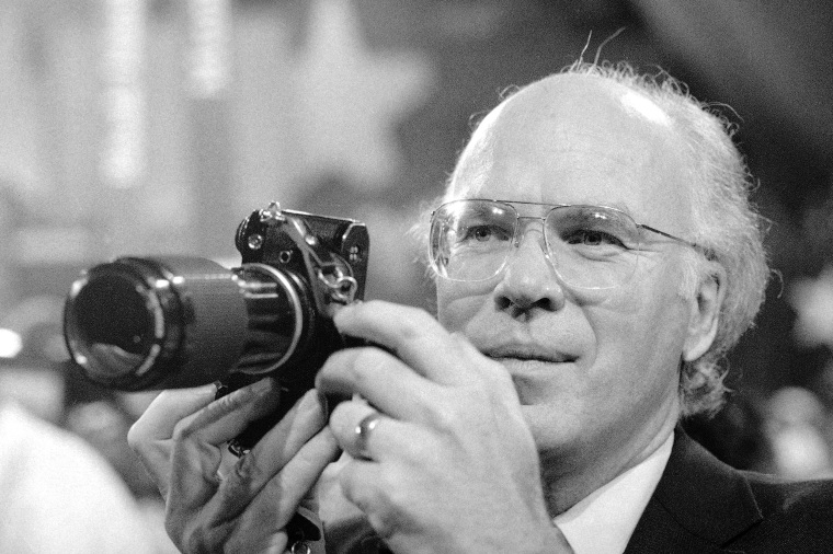 Patrick Leahy holding a camera