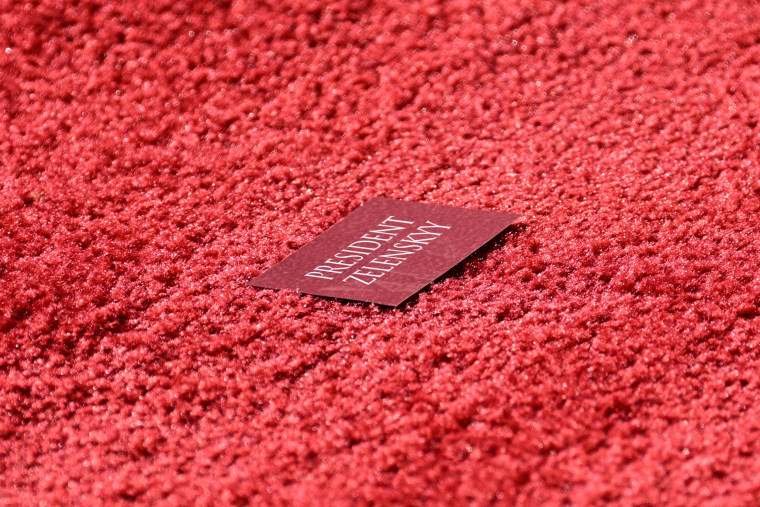 A name card bearing the name of Ukraine's President Volodymyr Zelenskyy is seen on a red carpet outside the White House on Dec. 21, 2022.