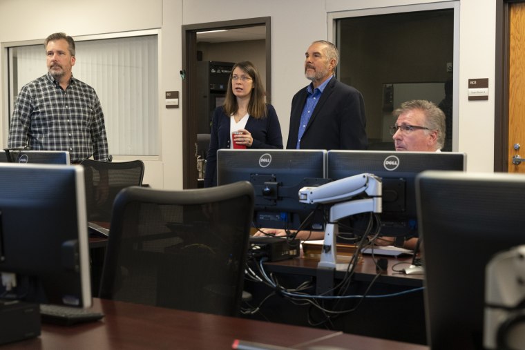 Maytubby, center, meets with Oklahoma City County Health Department staff members to review data on Covid case numbers and hospitalizations. 