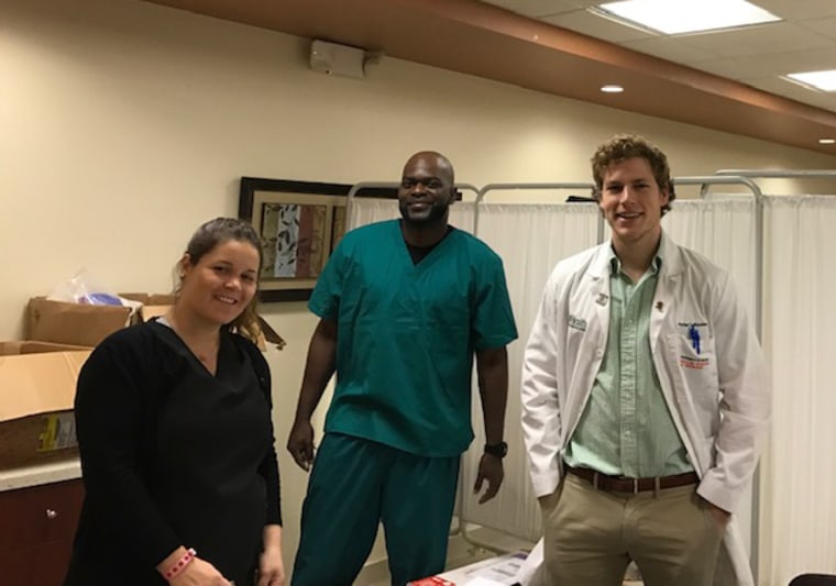 Dr. Katrina Celis, Director of Research Support Larry Adams, and Dr. Parker Bussies prepare to see Alzheimer’s disease patients and their families in Puerto Rico for PRADI.