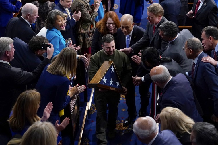 Image: Ukrainian President Volodymyr Zelenskyy holds an American flag gifted to him by Speaker Nancy Pelosi after he addressed a joint session of Congress at the Capitol in Washington on Dec. 21, 2022.