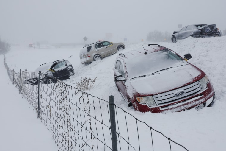 Vehicles sit along U.S. 131 in Byron Center, Mich. on Friday, Dec. 23, 2022. 