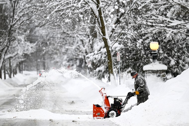 A man shovels snow after snowfall as death toll in the snowstorm, which was effective, reached 26 in Buffalo, New York, United States on December 26, 2022.