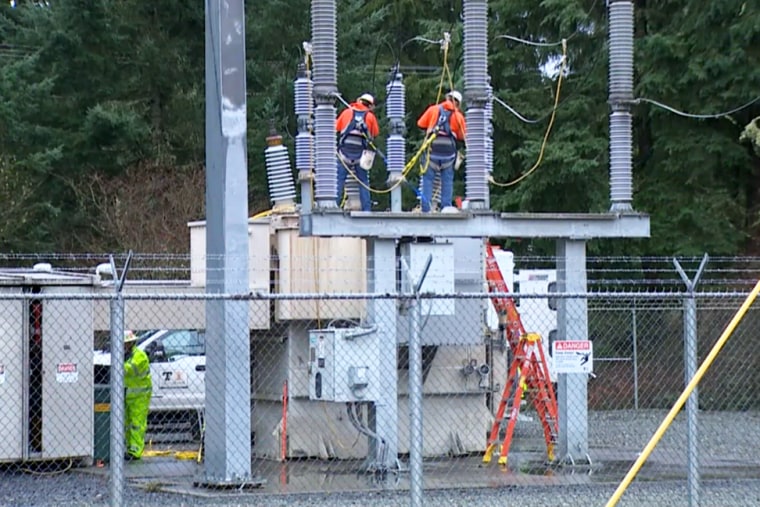 Crews work to restore power at an electricity substation in Pierce County, Washington, on Monday.