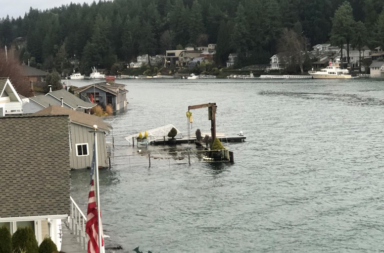 Flooding during high tide in Gig Harbor, Wash., on Tuesday.