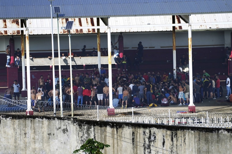 Detained migrants stand in the outdoor area of the Siglo XXI Migrant Detention Center in Tapachula, Mexico, 