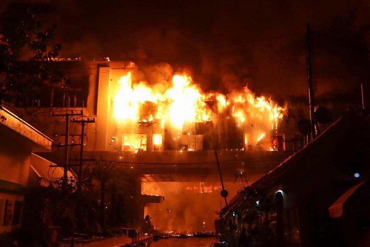 As many as 10 people have died in a fire at a Cambodian hotel-casino on the border of Thailand, with photos showing groups desperately huddled on ledges as fierce flames surround them.