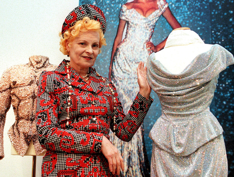 British fashion designer Vivienne Westwood poses with one of her creations on May 5 1999, on display at Christie's in Vienna with more than 20 dresses inspired by 18th century France.