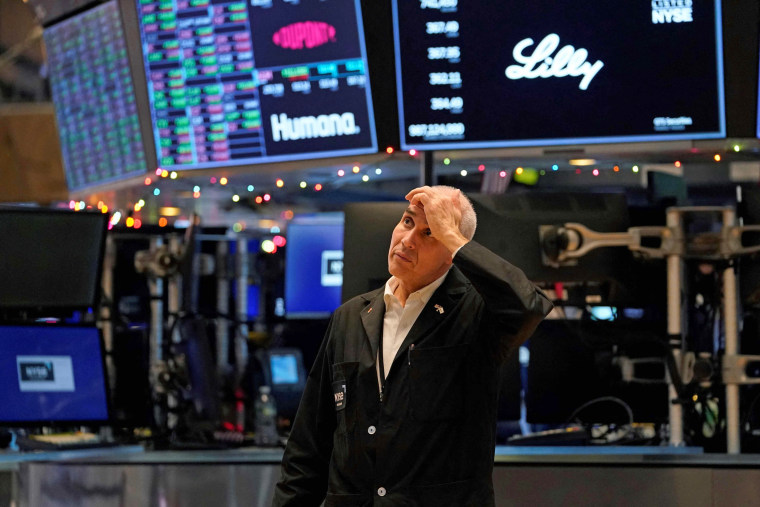 A trader reacts on the floor of the New York Stock Exchange at the closing bell on Dec. 30, 2022 in New York. 