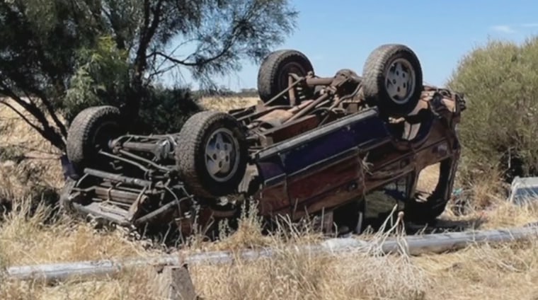 The overturned vehicle discovered after three children spent 55 hours in the Australian Outback. 