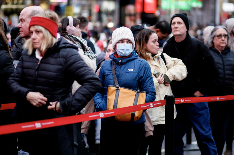A woman wearing a mask in Times Square on Dec. 10, 2022 in New York City.  