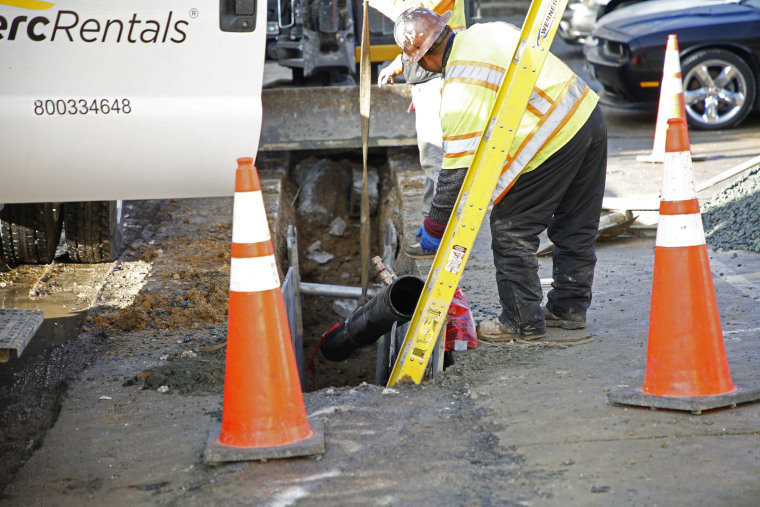 Construction workers repair water infrastructure in Baltimore.