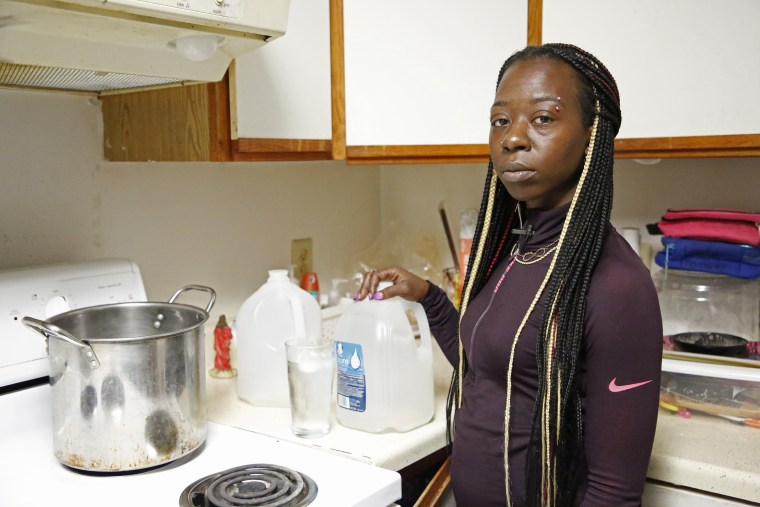 Gloria Johnson stands in her kitchen in southwest Baltimore.