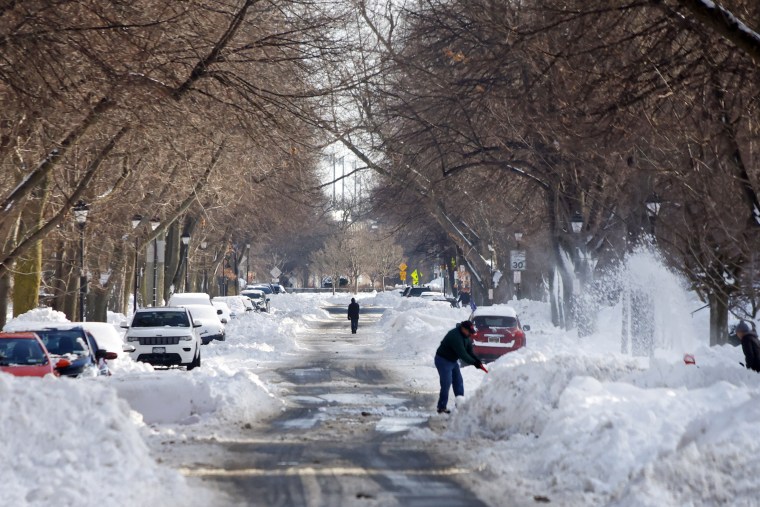 A person clears snow following the storm in Buffalo, New York, on Wednesday.