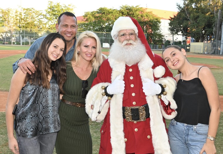 Ella Rodriguez, Alex Rodriguez, Jac Cordeiro and Natasha Rodriguez attend the Boys & Girls Clubs of Miami-Dade Toy Giveaway and Holiday Party on Dec. 14 2022 in Miami, Florida. 