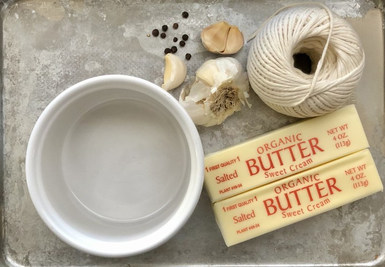 You can make your own butter candle with just butter, garlic, black pepper, cotton kitchen twine and a small container.