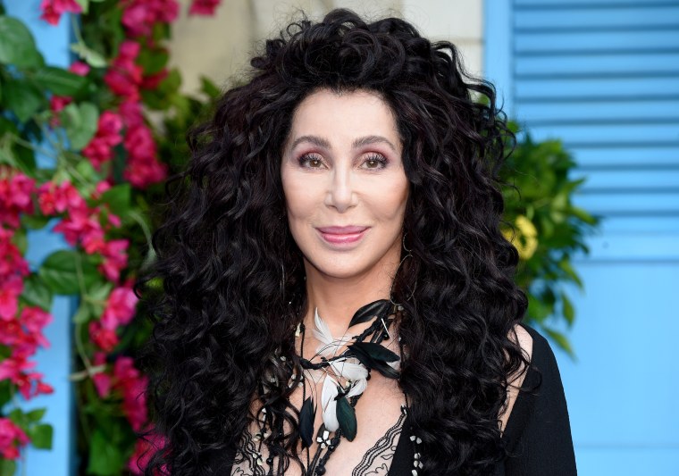 Cher poses on the red carpet upon arrival for the world premiere of the film "Mamma Mia! Here We Go Again" in London on July 16, 2018.