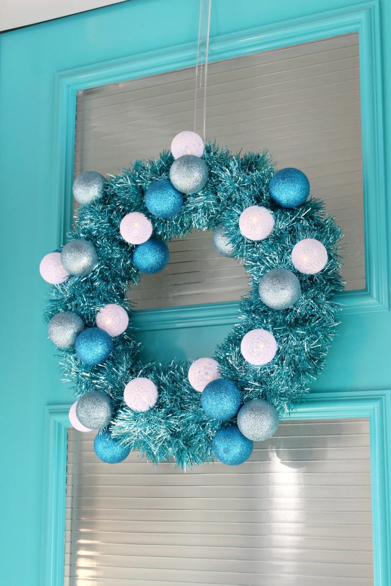 Blue tinsel wreath with white and silver trim
