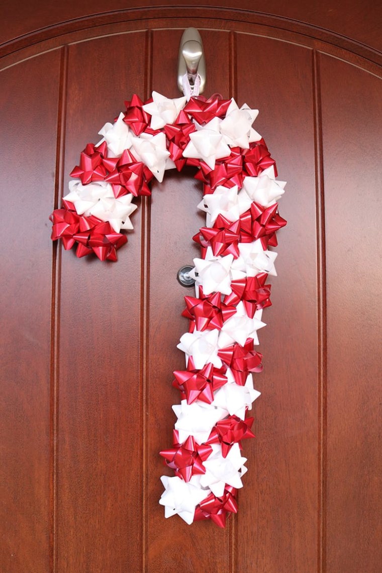 Red and white bows make up the candy cane door decoration 