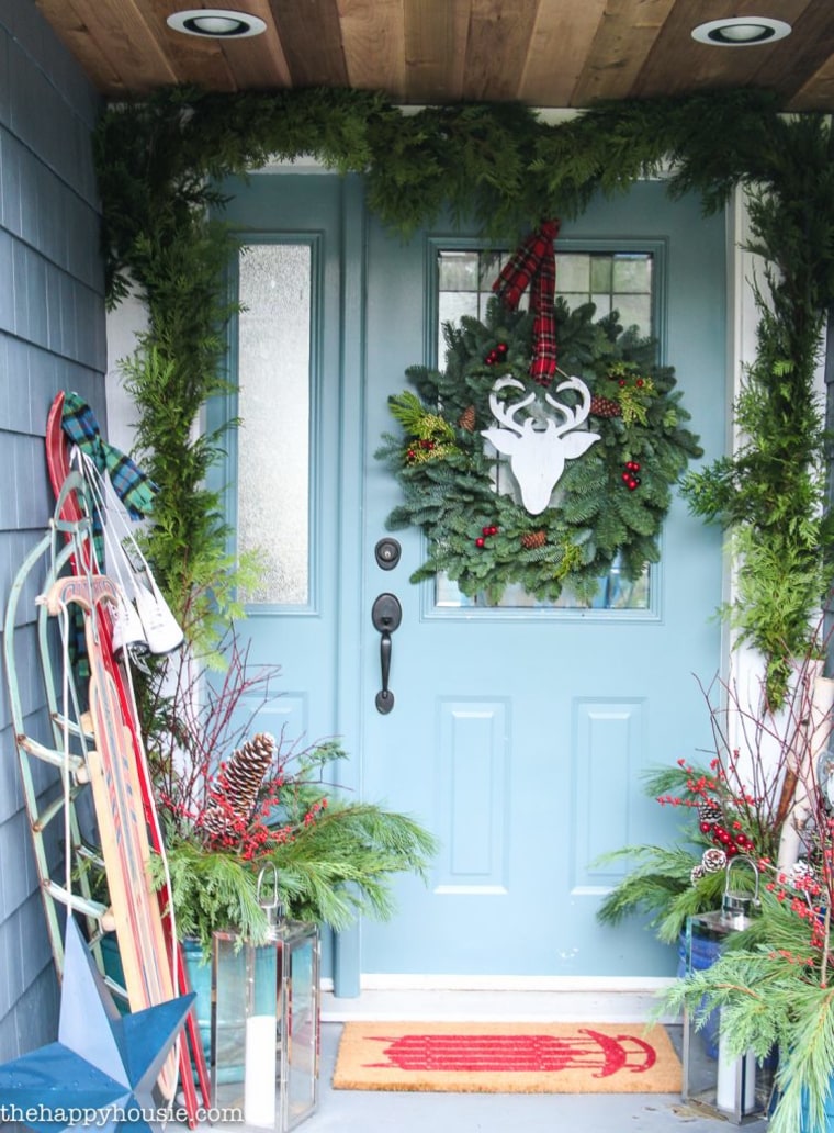 green wreath with wooden deer in the middle