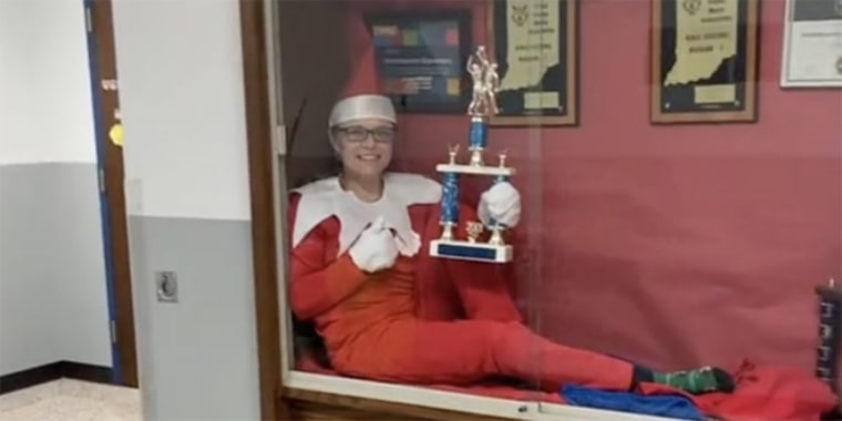 Beth Hoeing, principal of Southwestern Elementary School in central Indiana, can be seen in a TikTok video dressed as the "Elf on the Shelf" in different locations around the building.
