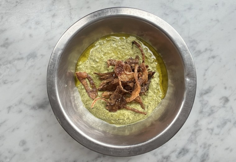Fava Bean Hummus, AKA Bessara, which is a slow-cooked fava bean dip that's blended with fresh herbs and tahini, topped with crispy onions.