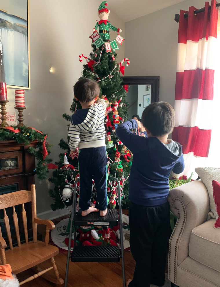 A.J. and Michael Schuber, ages 7 and 3, took the tree decorating into their own hands during a challenging year for their family.
