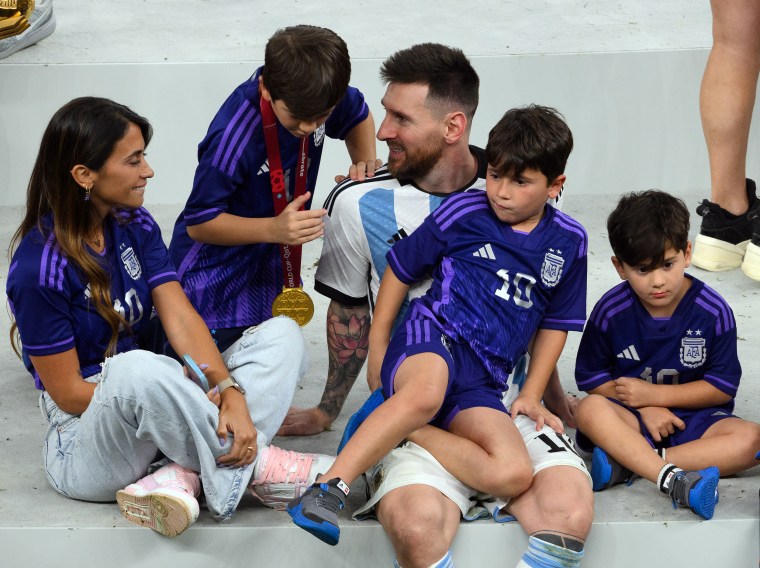 Lionel Messi with wife Antonela Roccuzzo and sons on the podium.