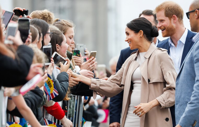 Meghan Markle and Prince Harry meeting fans.