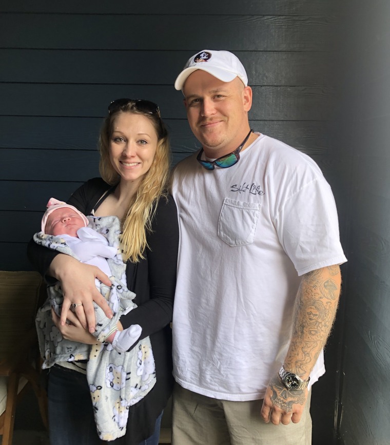 Hayley Rider pictured with her partner and their third child, a baby girl.