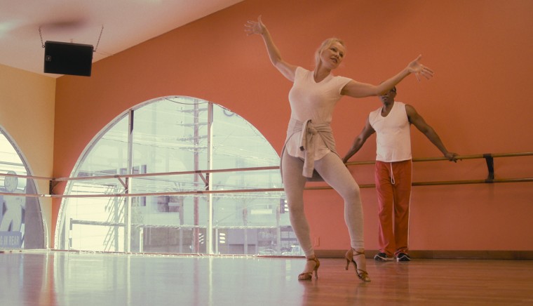 Pamela Anderson dances for performer Gregory Butler.