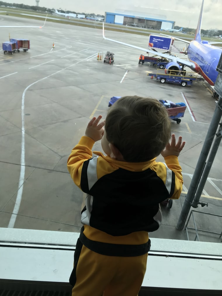 Karen Buono Johnson's 13-month-old son, looking out an airport window at all the Southwest Airlines planes not flying. 