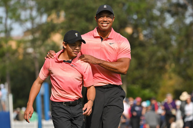 The father-son duo walk off the first tee box together during the first round of the PGA TOUR Champions PNC Championship at The Ritz-Carlton Golf Club on Dec. 17, 2022 in Orlando, Florida. 