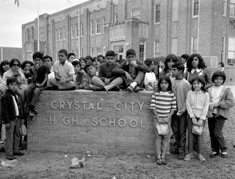 Students pose around a high school sign during a boycott in Crystal City, Texas, on Dec. 22, 1969.