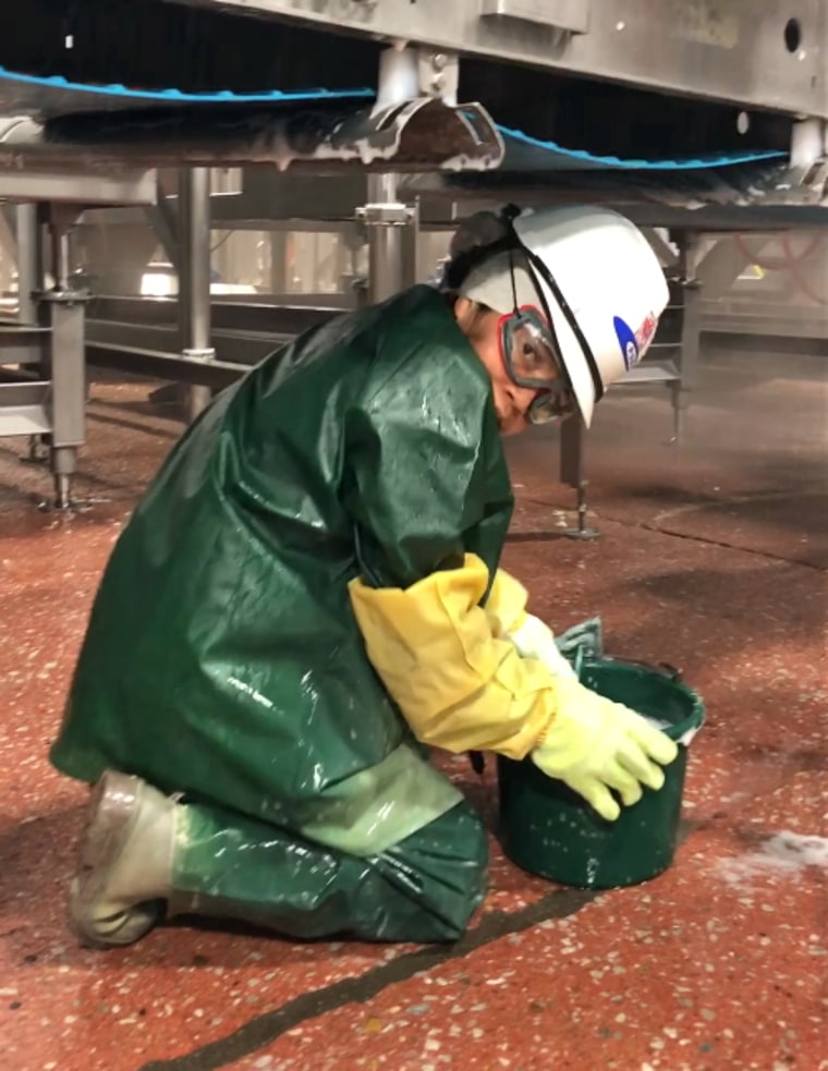 A worker at JBS Foods Plant in Grand Island, Neb.