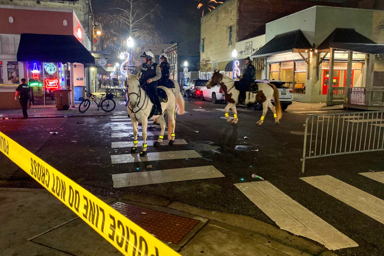 Police on horseback respond to the scene of a shooting in Mobile, Ala., on Dec. 31, 2022.
