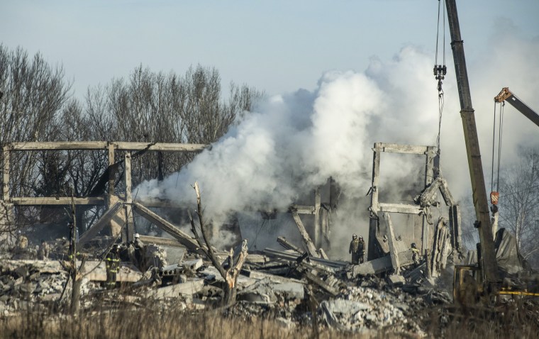 Russian emergency workers remove the rubble of a vocational school destroyed by shelling in Makiivka, in the occupied Donetsk region, on Jan. 2, 2023.