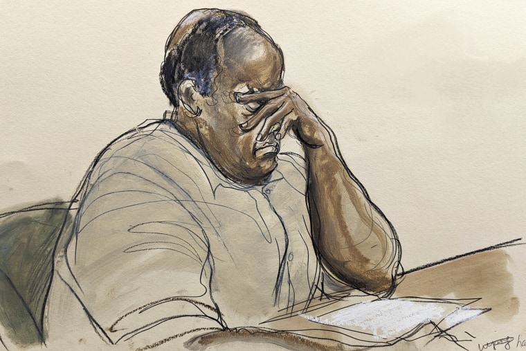 In this courtroom sketch, Frank James, listens as Judge Kuntz reads the updated charges against him in Brooklyn federal court, Tuesday, Jan. 3, 2023, in New York. James, who opened fire and wounded 10 passengers on a Brooklyn subway train last year has pleaded guilty to federal terrorism charges. Frank James admitted pulling the trigger on the Manhattan-bound train as it moved between stations on April 12. 