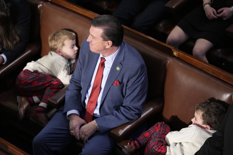 Rep. Kevin Mullin, D-Calif., sits with his children during a vote for the next House Speaker on the opening day of the 118th Congress at the U.S. Capitol, Tuesday, Jan. 3, 2023, in Washington.(AP Photo/Alex Brandon)