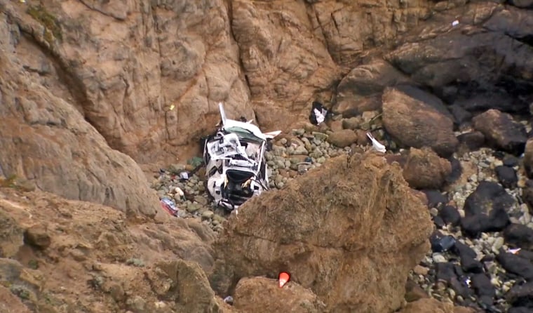 Aerial view of a Tesla that plunged over a cliff in San Mateo County.