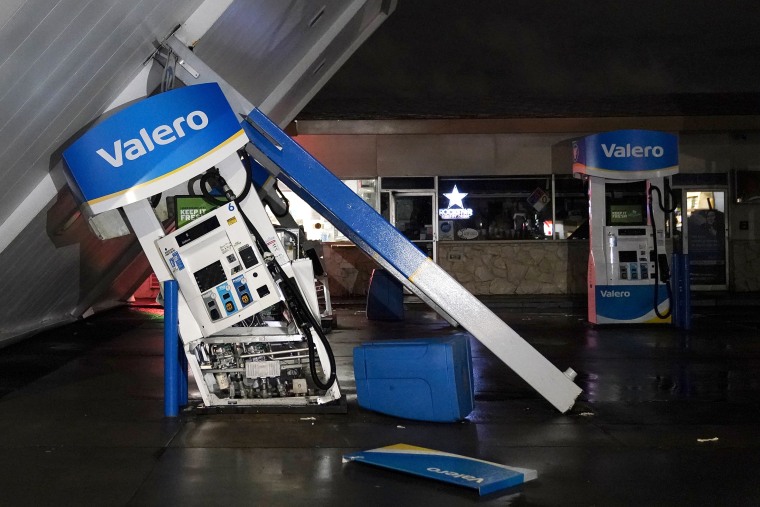 The canopy of gas station, toppled by strong winds, rests at an angle, Wednesday, Jan. 4, 2023,  in south San Francisco. Another winter storm moved into California on Wednesday, walloping the northern part of the state with more rain and snow. It's the second major storm of the week in the parched state. It follows storms that brought threats of flash flooding and severe thunderstorms across the southern U.S. and heavy snow in the upper Midwest.