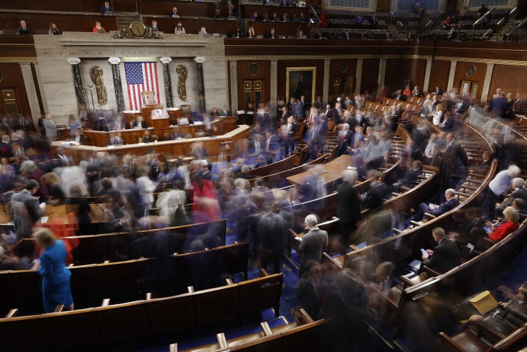 Members-elect of the 118th Congress leave the House chamber